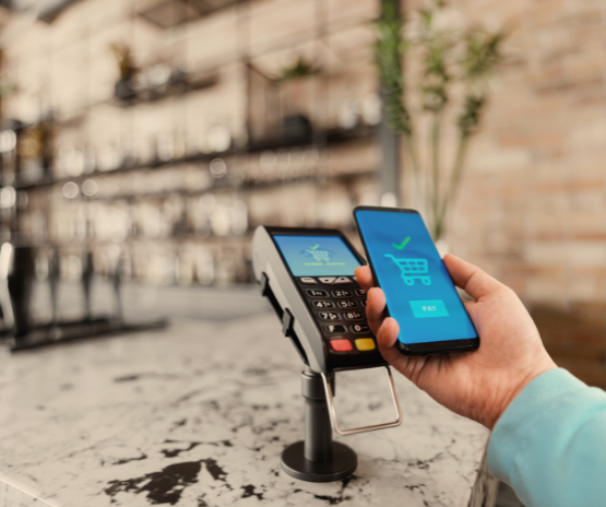 Person using their phone to pay at the register