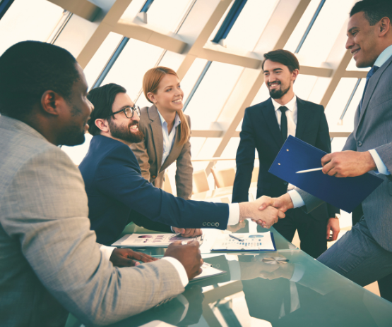 Business people in suits shaking hands