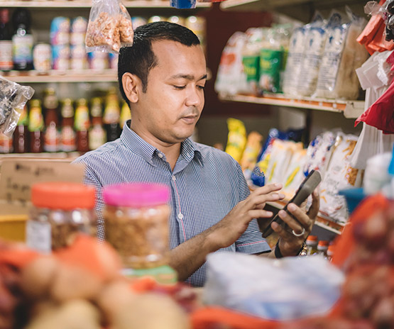 Business owner reviewing inventory in shop